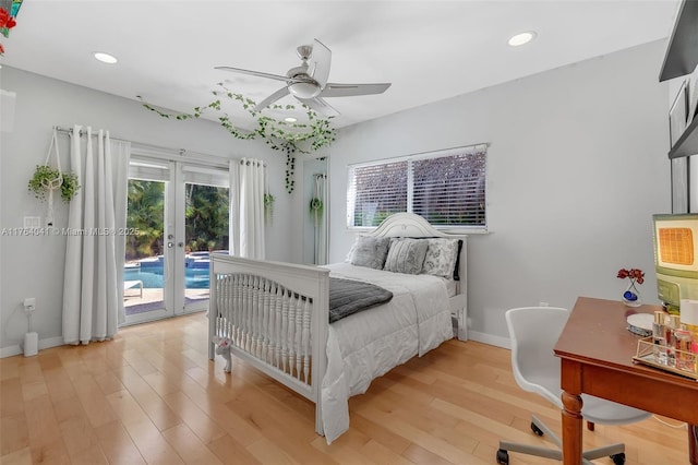 bedroom featuring access to exterior, recessed lighting, light wood-style flooring, and french doors