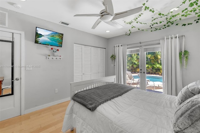 bedroom featuring visible vents, french doors, light wood finished floors, baseboards, and access to exterior