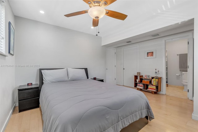 bedroom featuring connected bathroom, baseboards, ceiling fan, light wood-type flooring, and recessed lighting