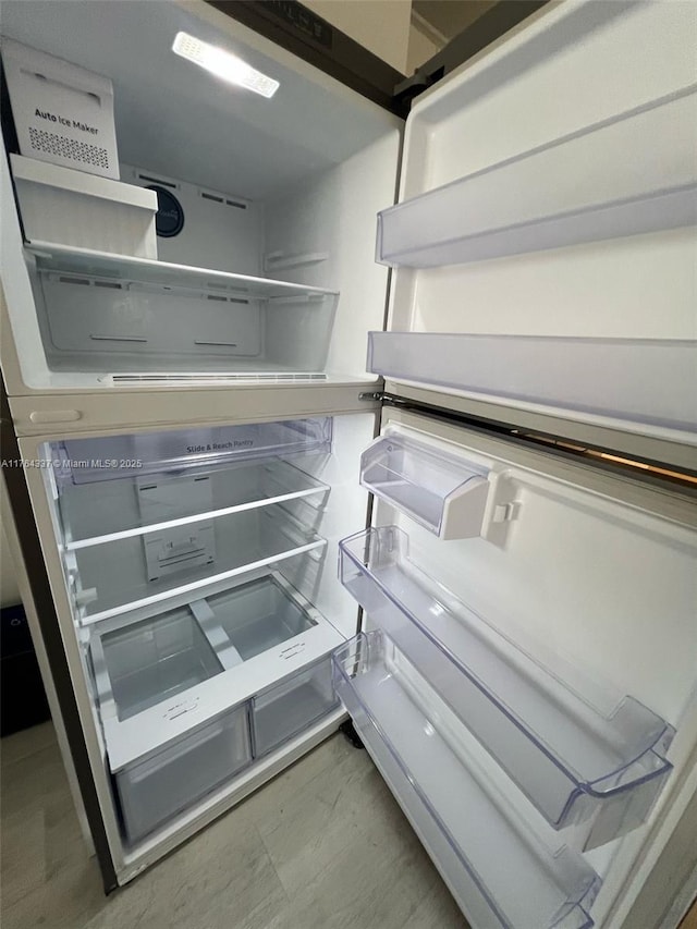 interior space with open shelves and refrigerator