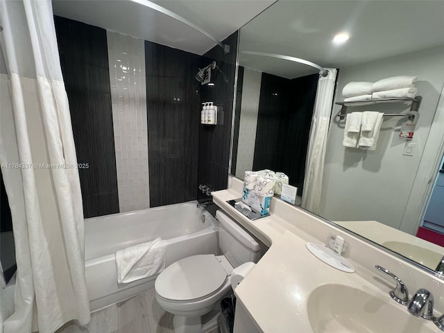 full bath featuring vanity, toilet, and shower / tub combo with curtain