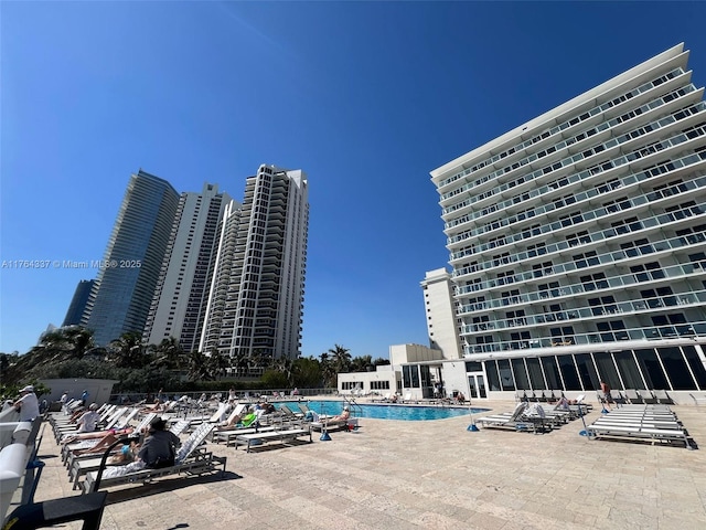 community pool featuring a patio area