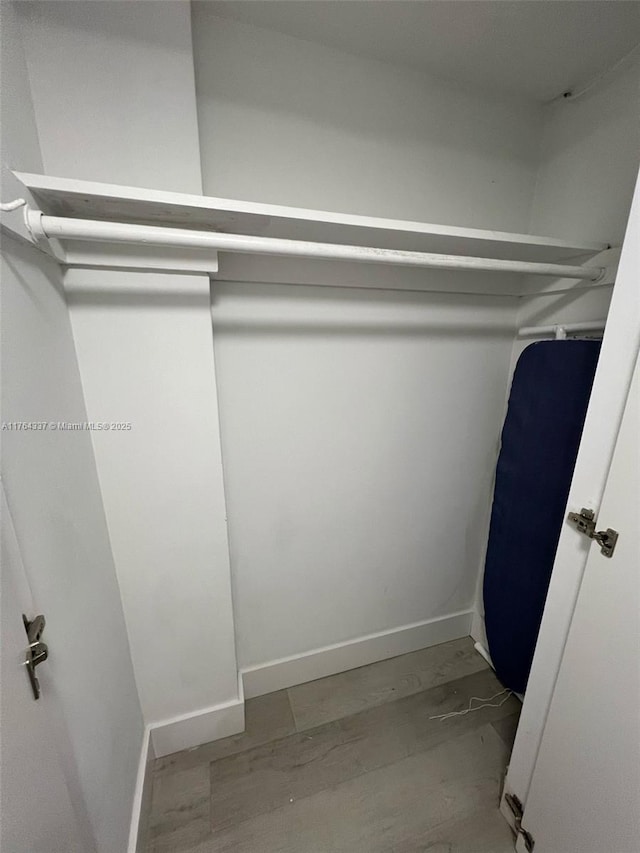 spacious closet featuring wood finished floors