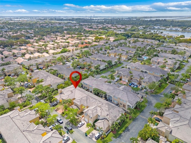 aerial view with a residential view and a water view