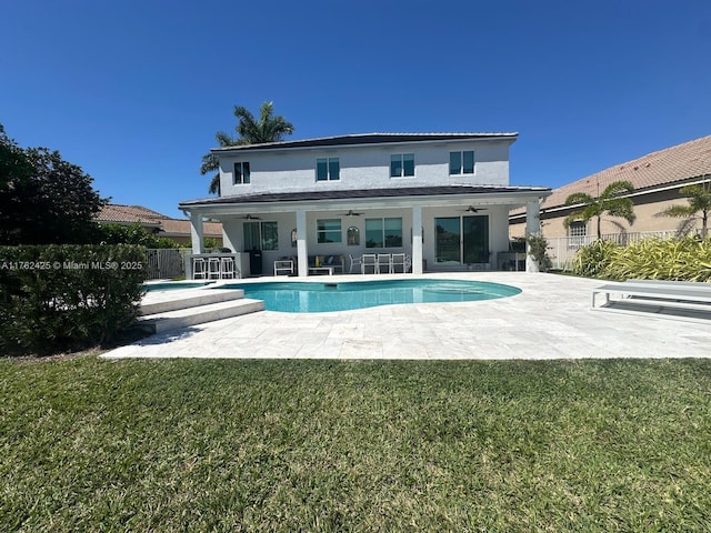 back of property featuring a patio area, a yard, ceiling fan, and fence