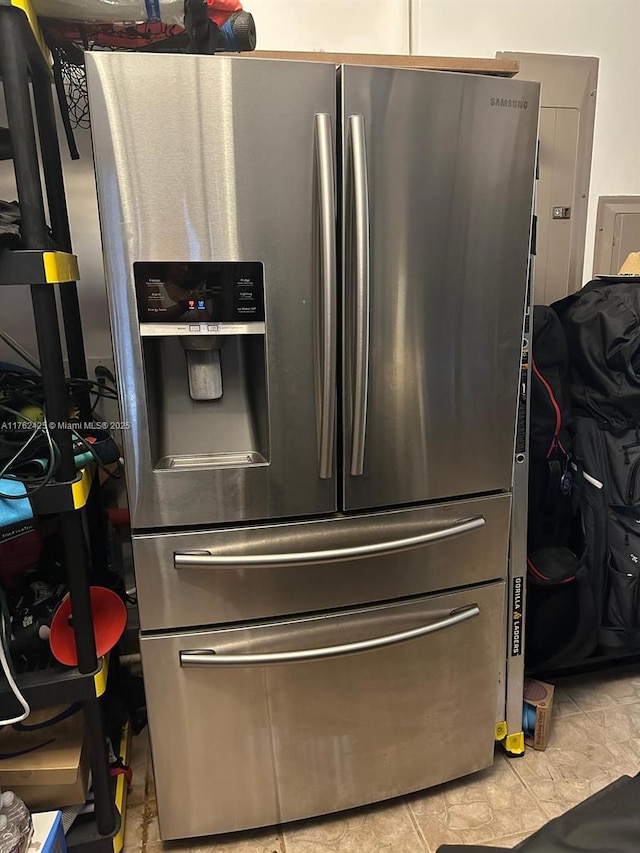 room details featuring stainless steel refrigerator with ice dispenser