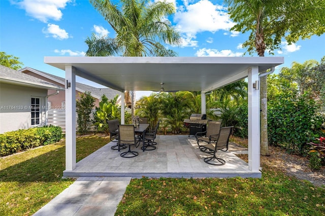 view of patio featuring a gazebo, a grill, outdoor dining area, and ceiling fan