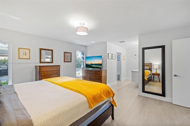 bedroom with visible vents and baseboards