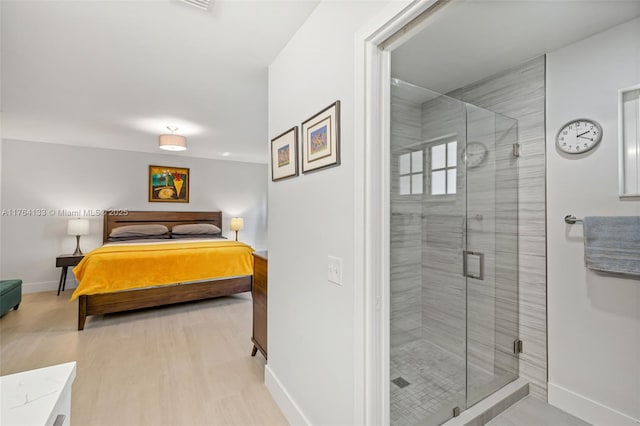 interior space featuring wood finished floors and baseboards