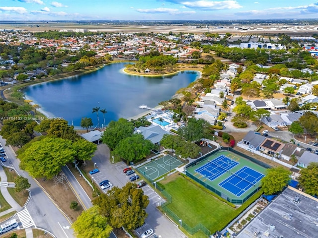 birds eye view of property with a water view and a residential view