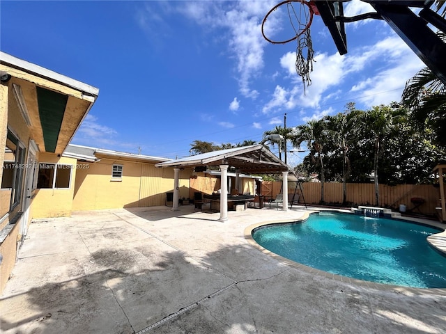 view of swimming pool with a fenced in pool, a patio, and a fenced backyard