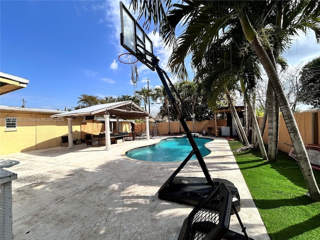 view of pool featuring a fenced in pool, a patio, and a fenced backyard