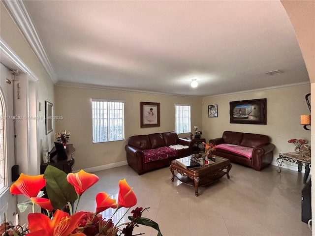 living room featuring light tile patterned flooring, visible vents, a wealth of natural light, and ornamental molding