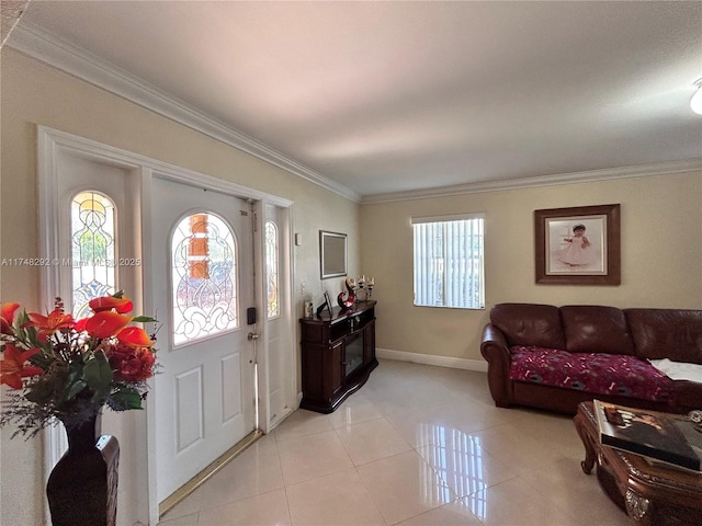 foyer entrance featuring light tile patterned floors, baseboards, and ornamental molding