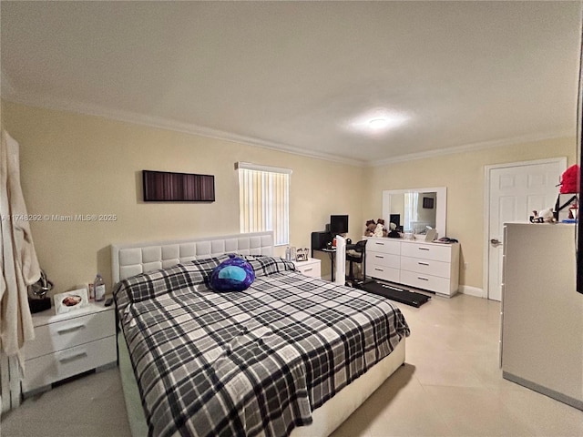 bedroom with baseboards and ornamental molding