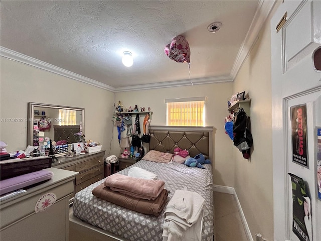 bedroom featuring crown molding, baseboards, and a textured ceiling