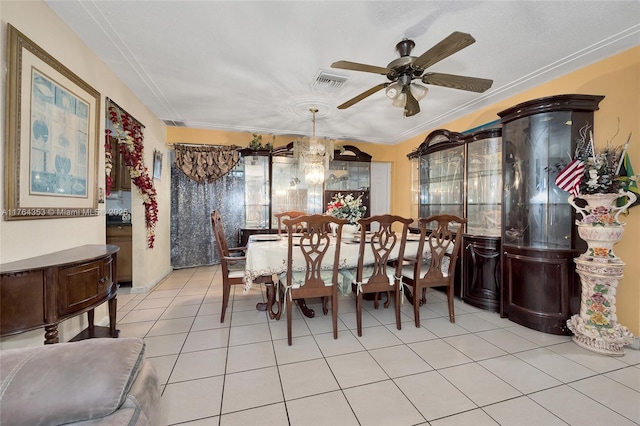 dining space with visible vents, ceiling fan, and light tile patterned flooring