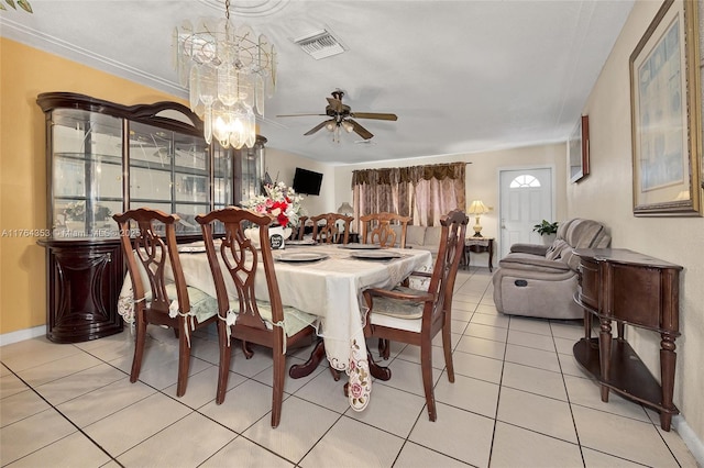 dining room featuring light tile patterned floors, visible vents, baseboards, and ceiling fan