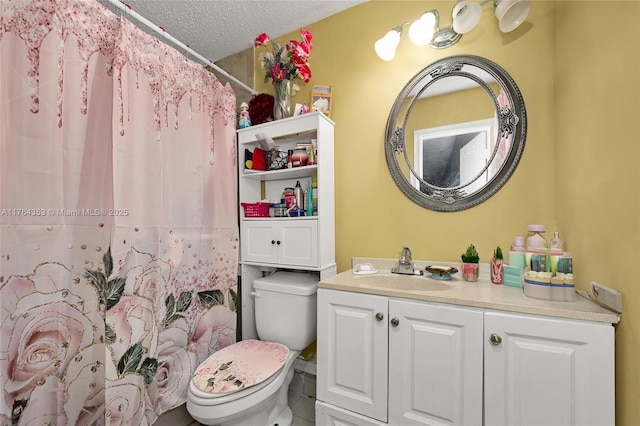 bathroom featuring toilet, curtained shower, a textured ceiling, and vanity