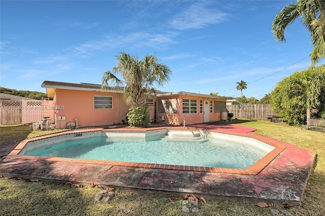 view of pool with a fenced in pool, a yard, and fence