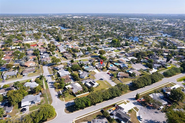 bird's eye view with a residential view and a water view