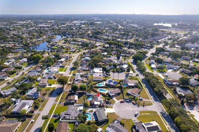 bird's eye view with a residential view and a water view