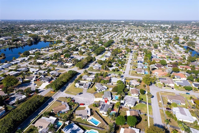 aerial view featuring a water view and a residential view