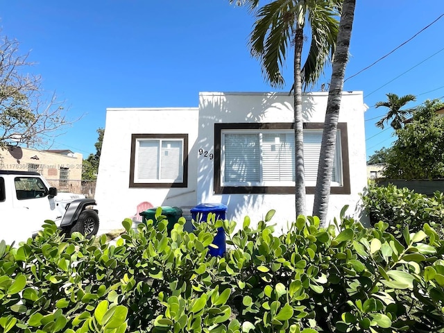 929 SW 12th Ave, Miami, FL 33130 - view of side of property with stucco siding and fence