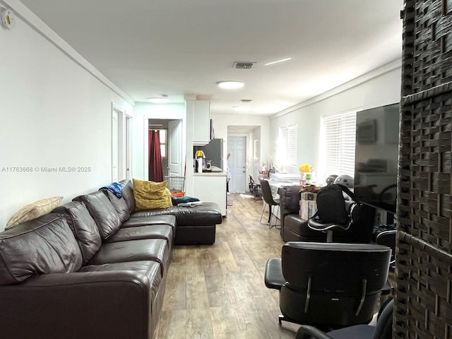 929 SW 12th Ave, Miami, FL 33130 - living room featuring visible vents and light wood finished floors