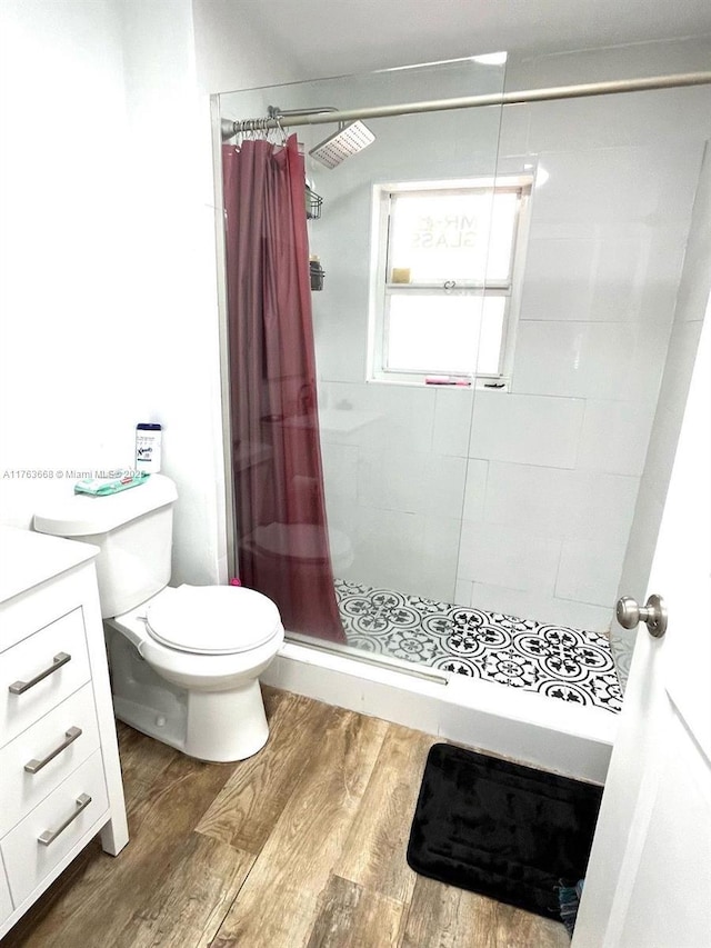 929 SW 12th Ave, Miami, FL 33130 - full bath with a stall shower, toilet, wood finished floors, and vanity