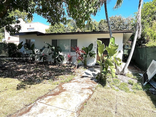 929 SW 12th Ave, Miami, FL 33130 - view of front of home with fence and stucco siding