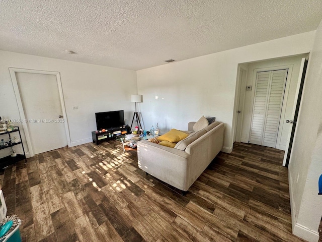 929 SW 12th Ave, Miami, FL 33130 - living area with baseboards, wood finished floors, visible vents, and a textured ceiling