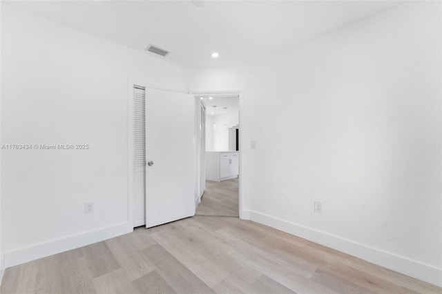 empty room with recessed lighting, visible vents, baseboards, and light wood-style flooring