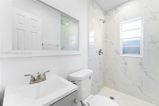 full bathroom featuring vanity, toilet, and a shower