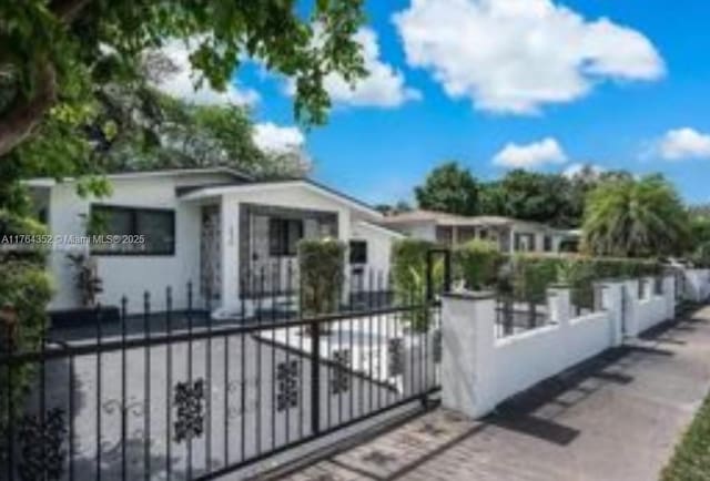view of gate featuring a fenced front yard