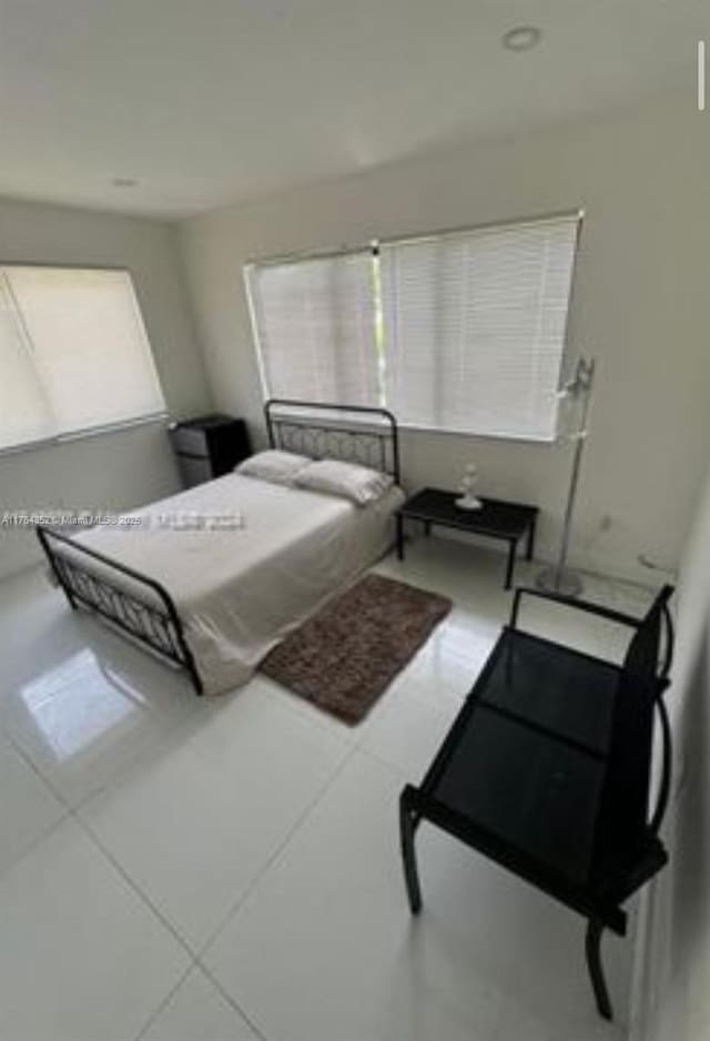 bedroom with multiple windows
