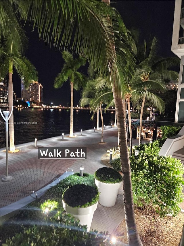 surrounding community featuring a water view