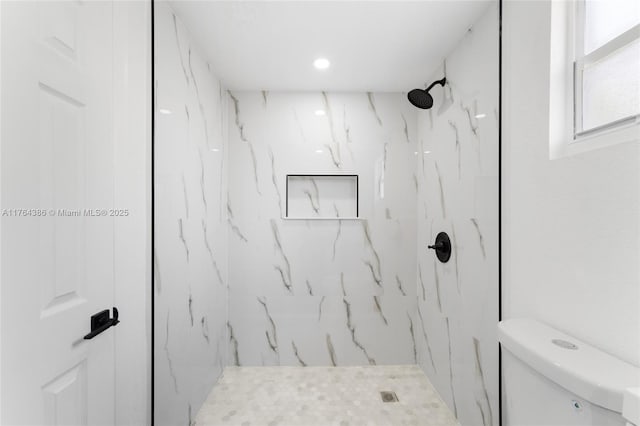 full bath featuring a marble finish shower and toilet