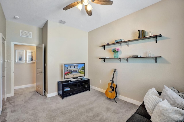 sitting room with visible vents, baseboards, ceiling fan, and carpet flooring