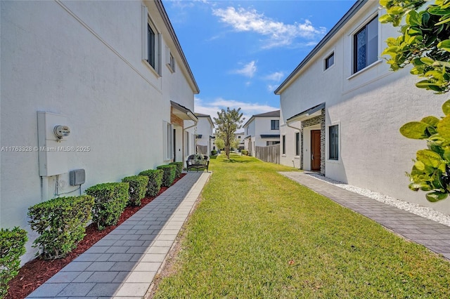 view of yard featuring a residential view and fence