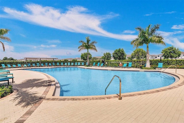 community pool featuring a patio area