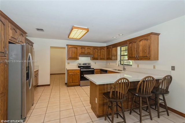 27820 SW 164th Ct, Homestead, FL 33031 - kitchen featuring appliances with stainless steel finishes, a sink, a peninsula, under cabinet range hood, and visible vents