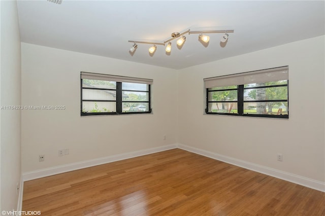 27820 SW 164th Ct, Homestead, FL 33031 - spare room with baseboards and light wood finished floors