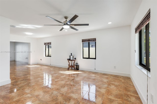 empty room with recessed lighting, baseboards, and a ceiling fan