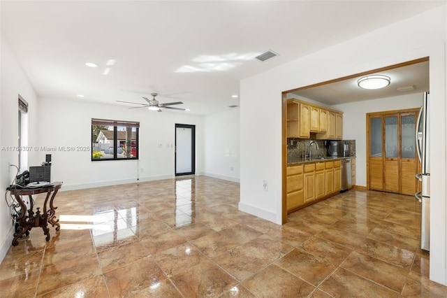 kitchen featuring visible vents, baseboards, tasteful backsplash, and dishwasher