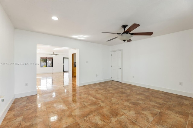 empty room featuring recessed lighting, baseboards, and a ceiling fan