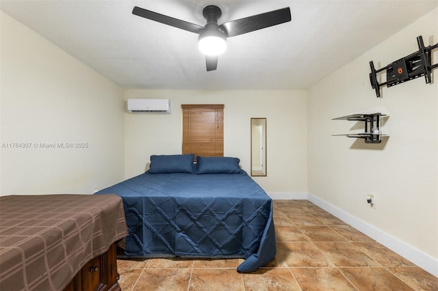 bedroom with a ceiling fan, baseboards, and a wall mounted AC