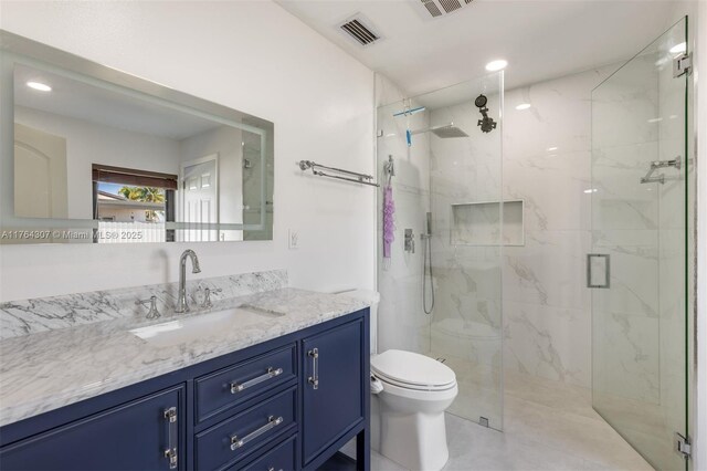 bathroom with a marble finish shower, visible vents, toilet, recessed lighting, and vanity