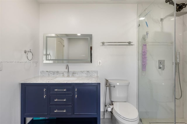 full bath with vanity, toilet, and a marble finish shower