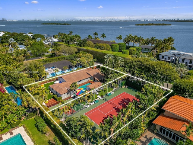 birds eye view of property featuring a water view